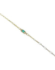 14K yellow gold paper clip bracelet with a rectangular natural emerald and diamond accents.