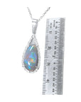 Pear-shaped Australian opal pendant with red-orange, blue-green play of color, halo diamonds, 18K white gold.