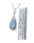 Pear-shaped Australian opal pendant with red-orange, blue-green play of color, halo diamonds, 18K white gold.