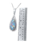 Pear-shaped Australian opal pendant with red-orange, blue-green play of color, halo diamonds, 18K white gold.