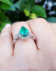 Halo diamond emerald ring bridal style pear cut engagement milgrain deco 14k white gold