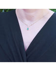 14k gold chevron V style with channel et natural diamonds with a dangling pear cut natural Colombian emerald