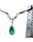 Bridals' emerald necklace pear cut 1.28 carats sourced from Muzo mines encircled by a halo diamond crafted in 14k white gold