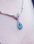 14k White gold Emerald necklaces pear cut 1.28 carats sourced from Muzo mines encircled by a halo diamond