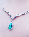 Emerald necklaces for ladies pear cut 1.28 carats sourced from Muzo mines encircled by a halo diamond crafted in 14k white gold