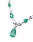 Emerald and diamond necklace: Natural diamonds pear shaped linked in 14k white gold individual settings with a wheat style