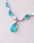 USA made women's emerald necklace for sale natural diamonds pear shaped individual settings complemented with a wheat style chain