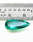 3.43 ct GIA certified natural pear-cut Colombian emerald, vibrant bluish-green, shown with a ruler.