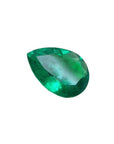 Pear cut natural loose Colombian emerald showcasing a vibrant, crystalline deep bluish-green hue.