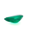 1.74-carat pear-cut Colombian emerald, vibrant deep bluish-green, on a white background.