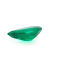 1.74-carat pear-cut Colombian emerald, vibrant deep bluish-green, on a white background.