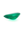 1.74-carat pear-cut Colombian emerald, vibrant deep bluish-green, on a white background.