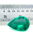 4.17 ct pear-cut natural Colombian emerald with vibrant medium-deep green hue, shown with ruler for scale.