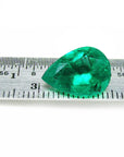 pear cut natural Colombian emerald Muzo mine, on a ruler front side for measure