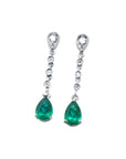 1.05 ct. pear-shaped emerald drop earrings in 14K white gold with diamond accents.