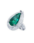 Pear-shaped 3.35 ct. emerald engagement ring in 14K white gold with diamond halo.