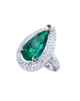 Pear-shaped 3.35 ct. emerald engagement ring in 14K white gold with diamond halo.