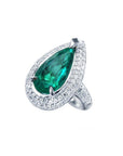 Pear-shaped 3.35 ct. emerald engagement ring in 14K white gold with diamond halo.