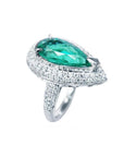Pear-shaped 3.35 ct. emerald engagement ring in 14K white gold with diamond halo.