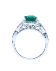 This white gold emerald ring displays its top and gallery profile on a white background.