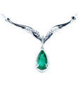 1.28 carat pear cut emerald necklace in 14K white gold with diamond halo and chevron design.
