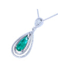 2.13 ct. teardrop emerald pendant with double diamond halo in 18K white gold.