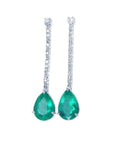 Pear shape 5.05 ct. Colombian emerald drop earrings with diamond accents in 18K white gold.