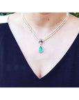 Pearl necklace gift for Mother's Day emerald enhancer pendant pear cut medium green hue 6.01 carats