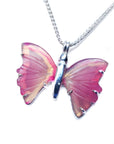 Butterfly-shaped agate pendant on a silver chain left side profile against a white background