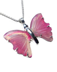 Pink natural agate butterfly pendant with carved wings on a sterling silver necklace.