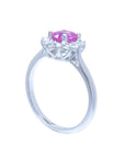 14K white gold ring with oval pink sapphire and diamond halo.