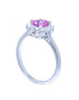 14K white gold ring with oval pink sapphire and diamond halo.