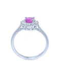 14K white gold women's ring with oval pink sapphire and diamond halo.