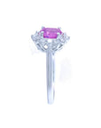 14K white gold ring with oval pink sapphire and diamond halo.