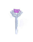 14K white gold ring with oval pink sapphire and diamond halo.