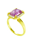 Emerald-cut pink sapphire ring with diamond halo in 14K yellow gold.