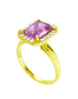 Emerald-cut pink sapphire ring with diamond halo in 14K yellow gold.
