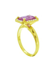 Emerald-cut pink sapphire ring with diamond halo in 14K yellow gold.