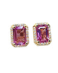 Natural pink sapphire stud earrings halo diamonds crafted in 14k yellow gold.