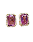 Natural pink sapphire stud earrings halo diamonds crafted in 14k yellow gold.