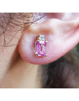 14K yellow gold stud earring with a rectangular pink sapphire and a round diamond.
