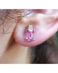 14K yellow gold stud earring with a rectangular pink sapphire and a round diamond.