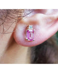 14K yellow gold stud earring with a rectangular pink sapphire and a round diamond.