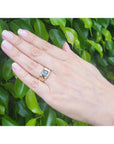 Men's 14k yellow gold pinky ring with a rectangular, medium dark blue sapphire, bezel set.