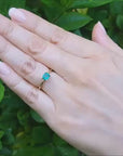 Minimalist emerald solitaire ring May's birthstone in yellow gold
