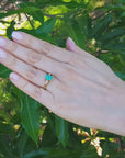Emerald and side baguettes diamond ring