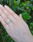 East west natural emerald ring