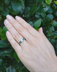 Round cut Emeralds and Diamond Ring