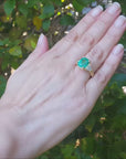 Emerald and trillion side diamond rings