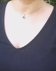 Round cut natural colombian emerald pendant necklace yellow gold.